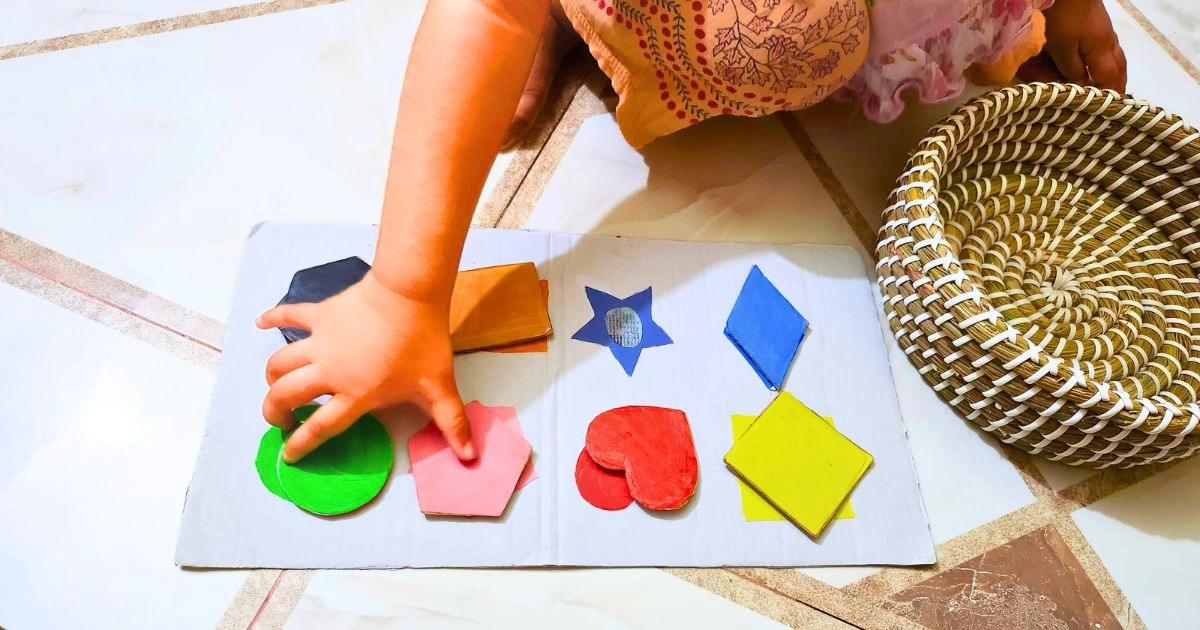 a toddler sorting shapes